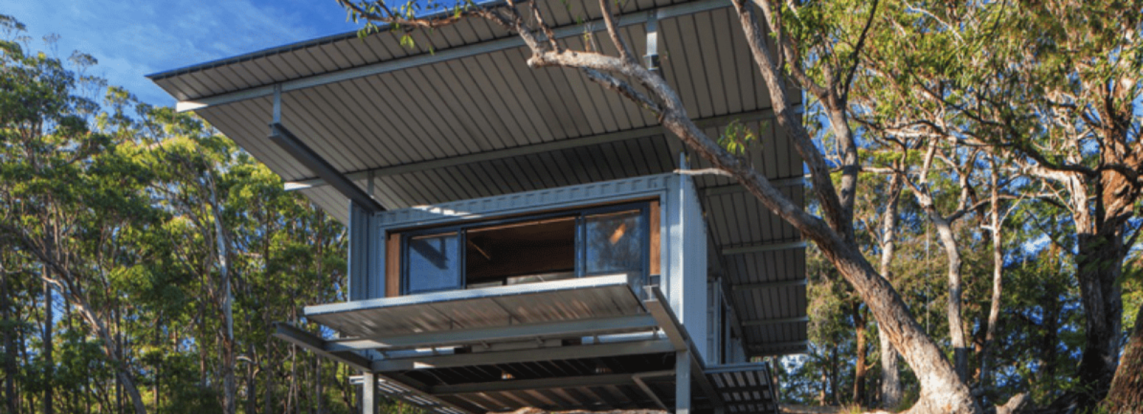 A photo of a home nestled in the bush; a representative example of biophilic design