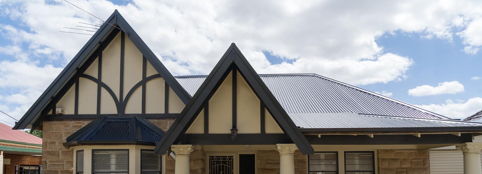 Heritage design house featuring Lysaght CUSTOM ORB® roofing in Monument®
