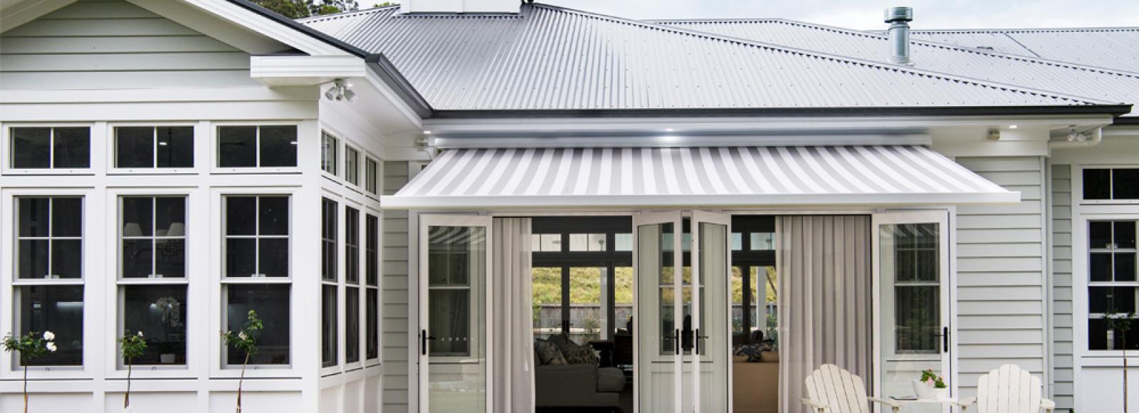 Front view of a contemporary house featuring Lysaght COLORBOND® roof sheets in light grey roof colour