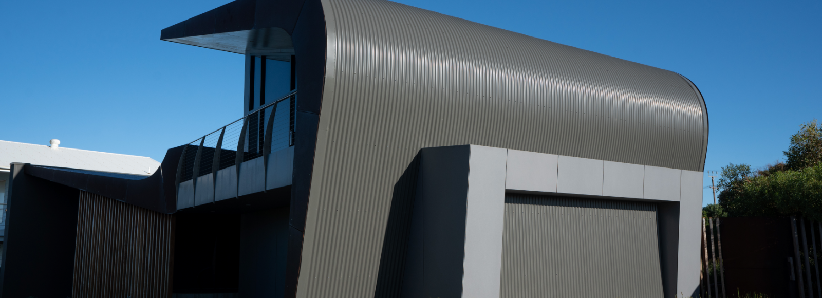 Explore a Middleton residential project where architectural cladding supports a distinctive wave form, whilst addressing the realities of a coastal environment