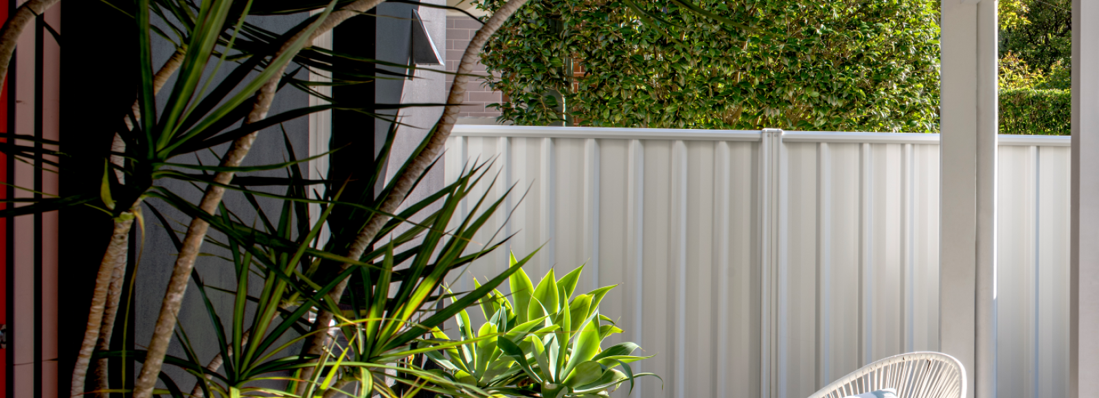 Lysaght fencing within an outdoor landscape scene