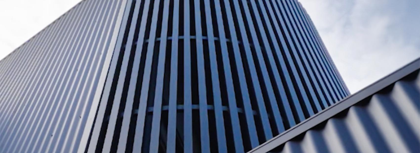 Ripple House: Modern Design with CUSTOM ORB® Cladding