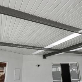 Carport with FLATDEK steel roofing manufactured from COLORBOND steel double-sided in topside colour Shale Grey and underside colour Surfmist