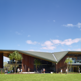 Modern building featuring a Lysaght COLORBOND® steel roof in a unique architectural design.