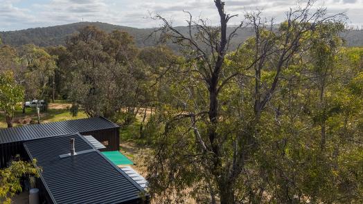 to LYSAGHT KLIP-LOK® 700 CLASSIC roofing and Half Round Guttering, made from COLORBOND® steel in Night Sky® at a property in Aireys Inlet, Victoria. 