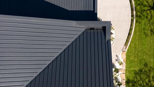  Aerial view of modern home roof with LYSAGHT® metal roofing sheets in Standing Seam profile