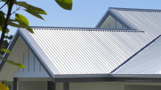 Gable roof with steel sheets and neatly detailed flashings designed for effective weatherproofing roof edges.