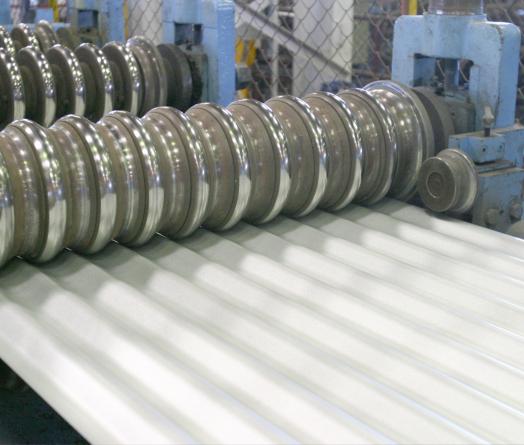 A rollforming machine producing CUSTOM ORB® corrugated steel cladding