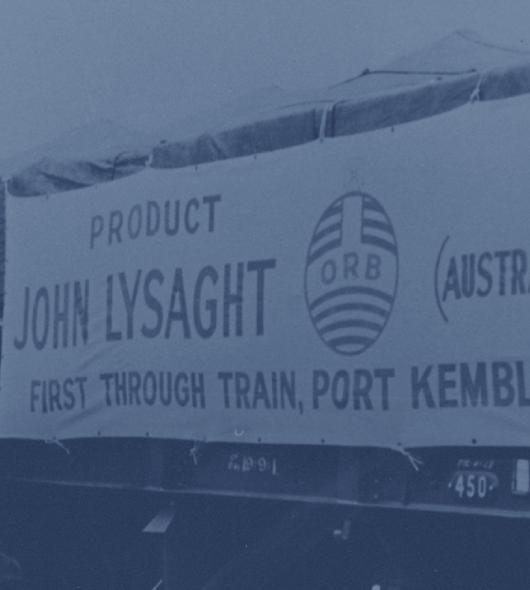 A photo of the first through train from Port Kembla to Melbourne, loaded with Lysaght ORB roofing