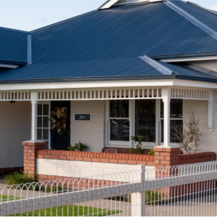 House with CUSTOM ORB ACCENT steel roofing manufactured from COLORBOND steel in colour Basalt