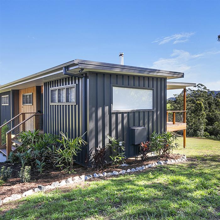 : Rural home with sleek black Lysaght wall cladding, designed for Australian conditions