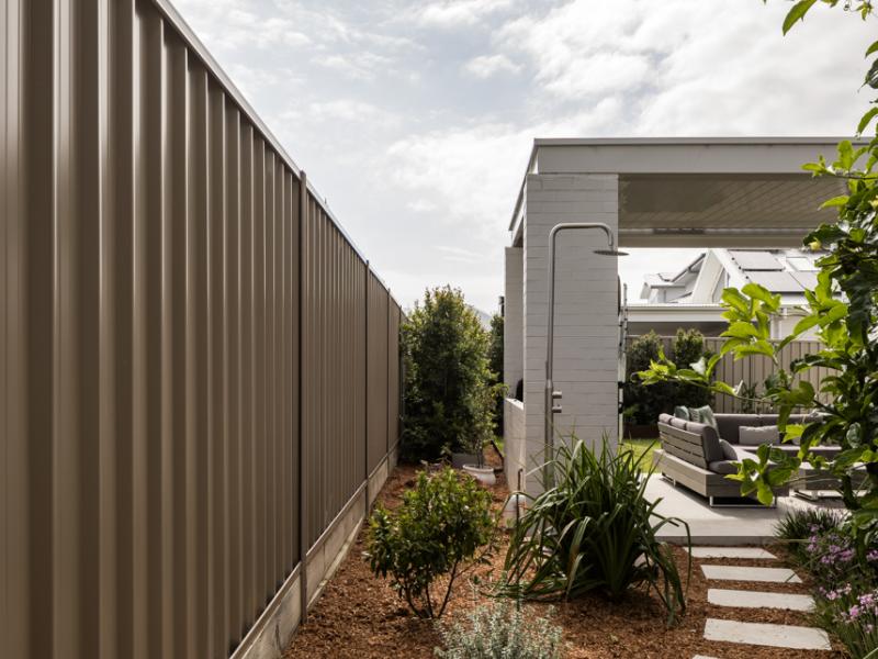 Lysaght fencing within an outdoor landscape scene