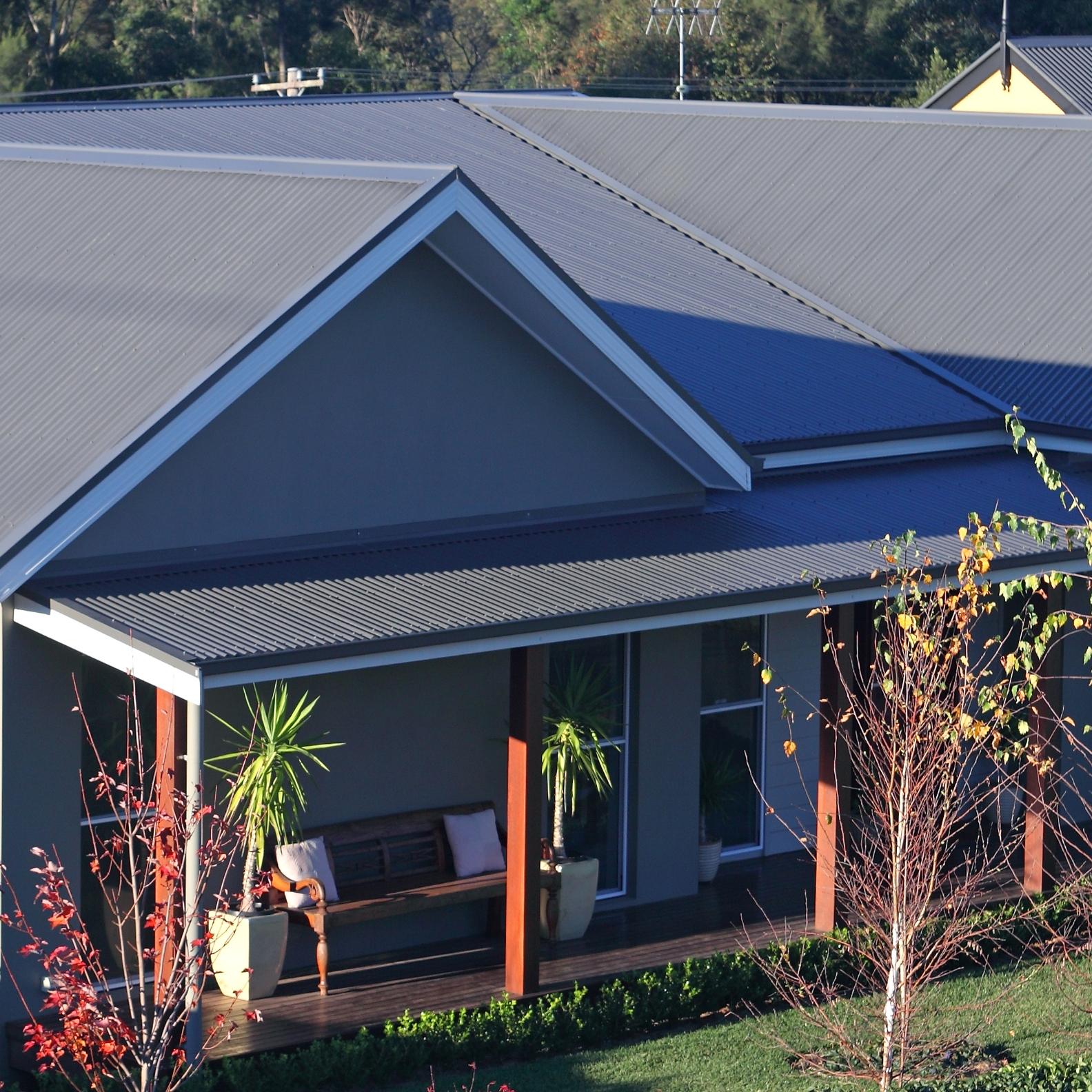House with CUSTOM ORB steel roofing manufactured from COLORBOND steel in colour Woodland Grey