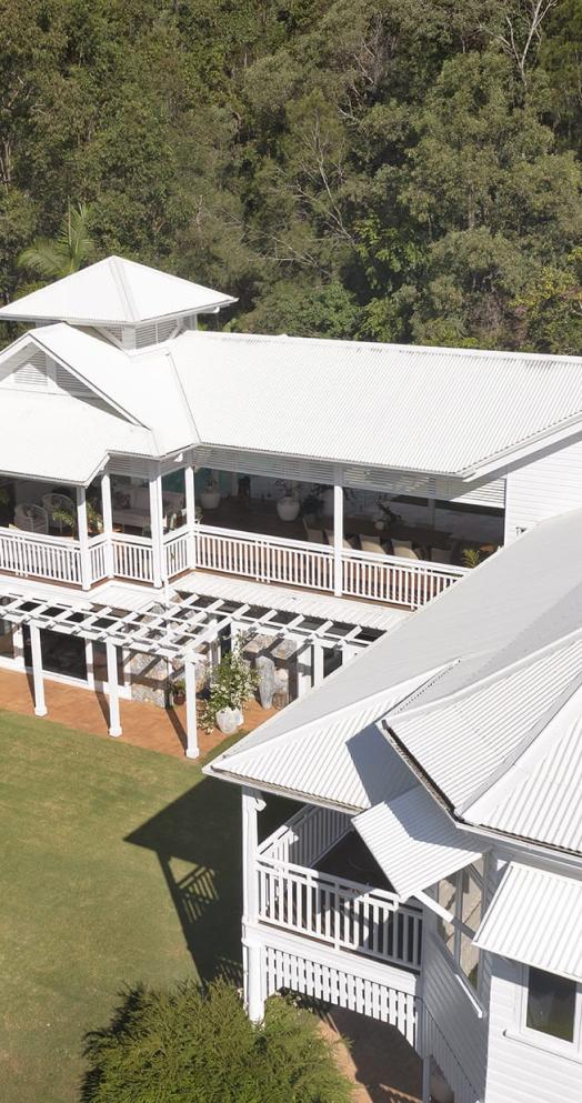 Queenslander house with custom orb roofing in surfmist