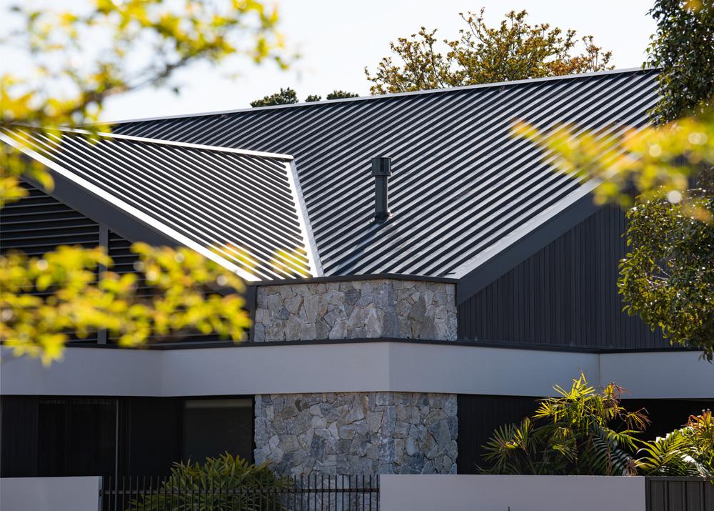 Contemporary home with hip roof clad in LYSAGHT® metal roofing sheets in a ribbed steel profile