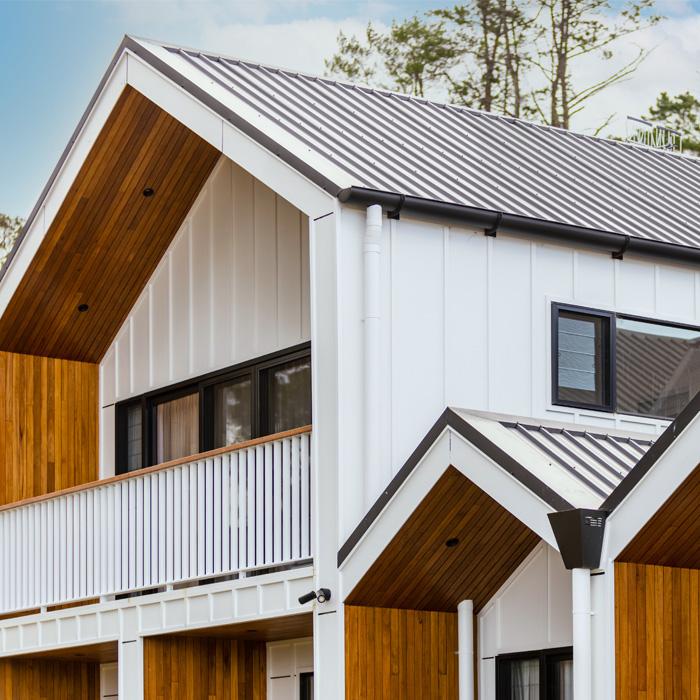 Modern two-storey home with Lysaght COLORBOND® steel roofing sheets in a dark grey roof colour
