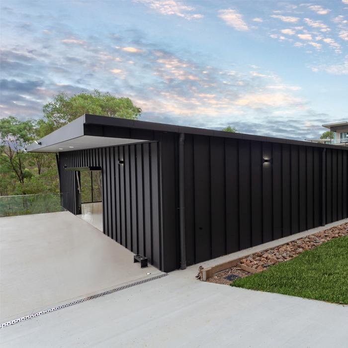 Side elevation of a home with vertical LYSAGHT ENSEAM® cladding forming a refined modern facade.