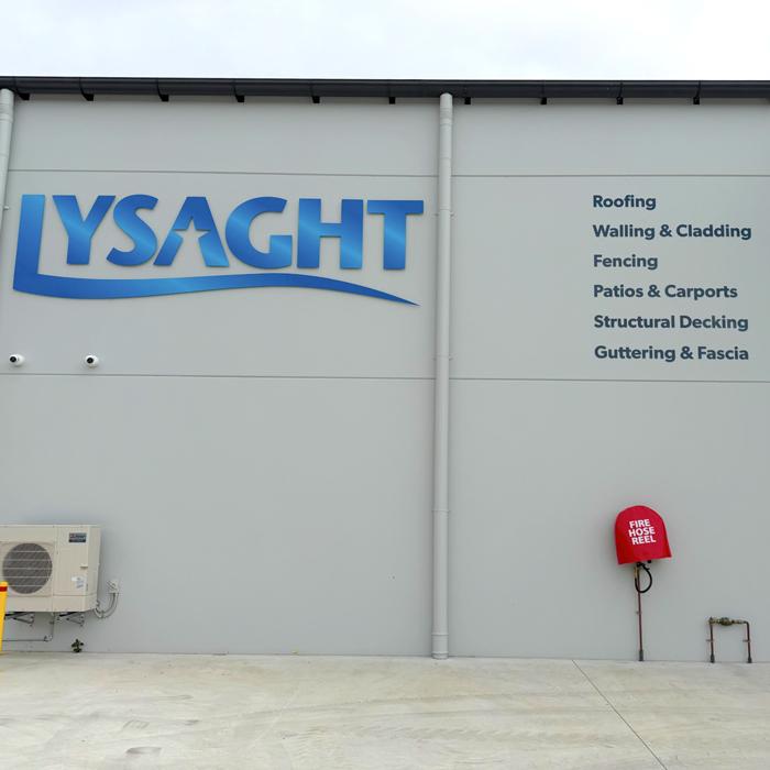 Lysaght sign and product range list on the side wall of Lysaght Port Macquarie