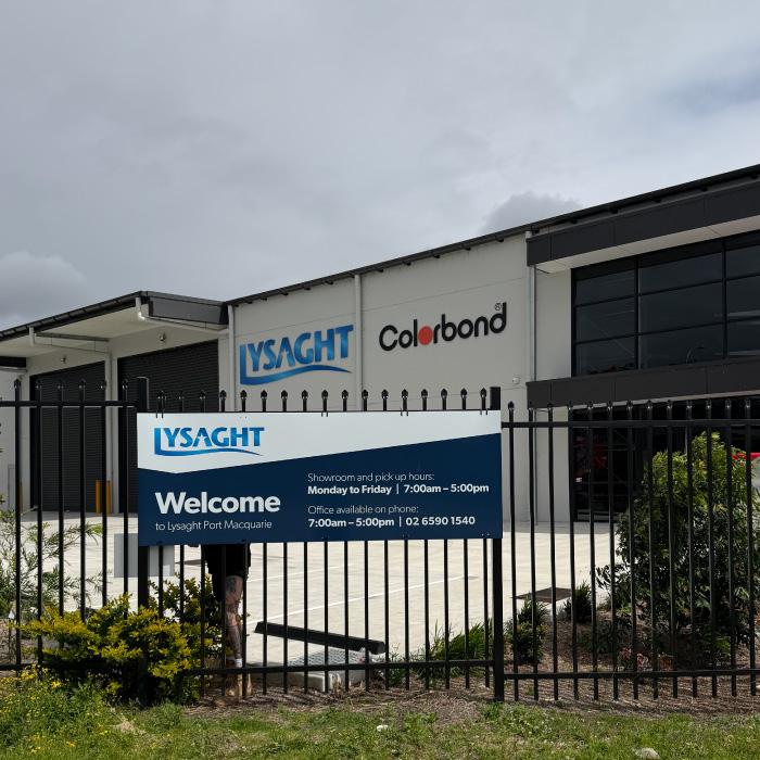 Welcome sign at the front fence of Lysaght Port Macquarie showing showroom and pick-up hours