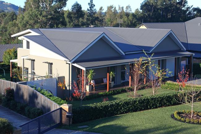 House with CUSTOM ORB steel roofing manufactured from COLORBOND steel in colour Woodland Grey