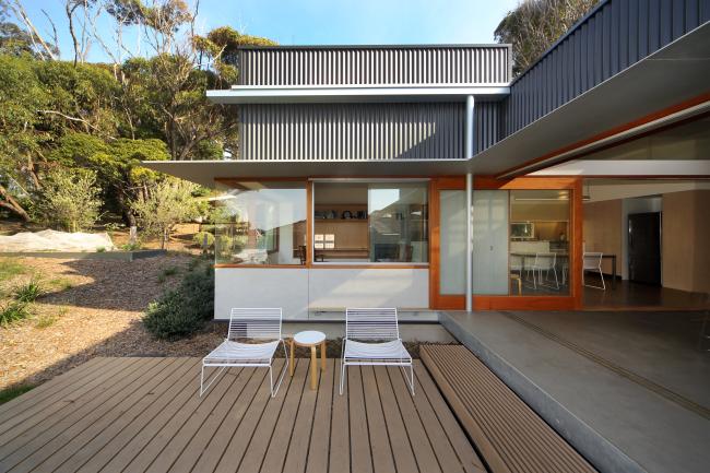 House with CUSTOM ORB steel walling manufactured from COLORBOND steel in colour Monument