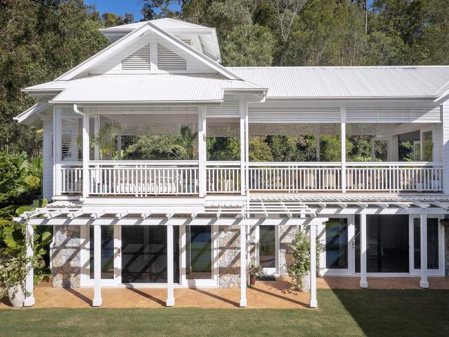 Queenslander house on Mogill Road QLD with custom orb roofing in surfmist