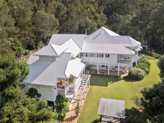 Queenslander House on Mogill Road QLD with custom orb roofing in surfmist