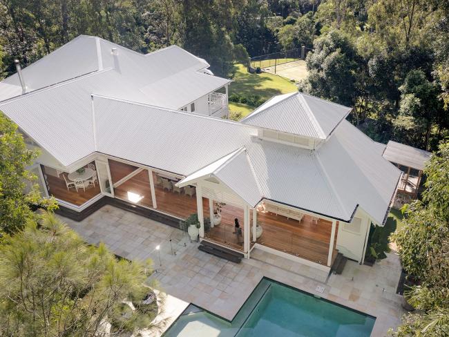 Queenslander House on Mogill Road QLD with custom orb roofing in surfmist
