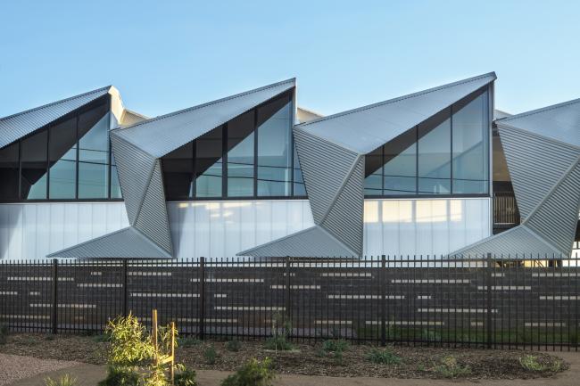 Office building with CUSTOM ORB steel walling manufactured from COLORBOND steel in colour Windspray